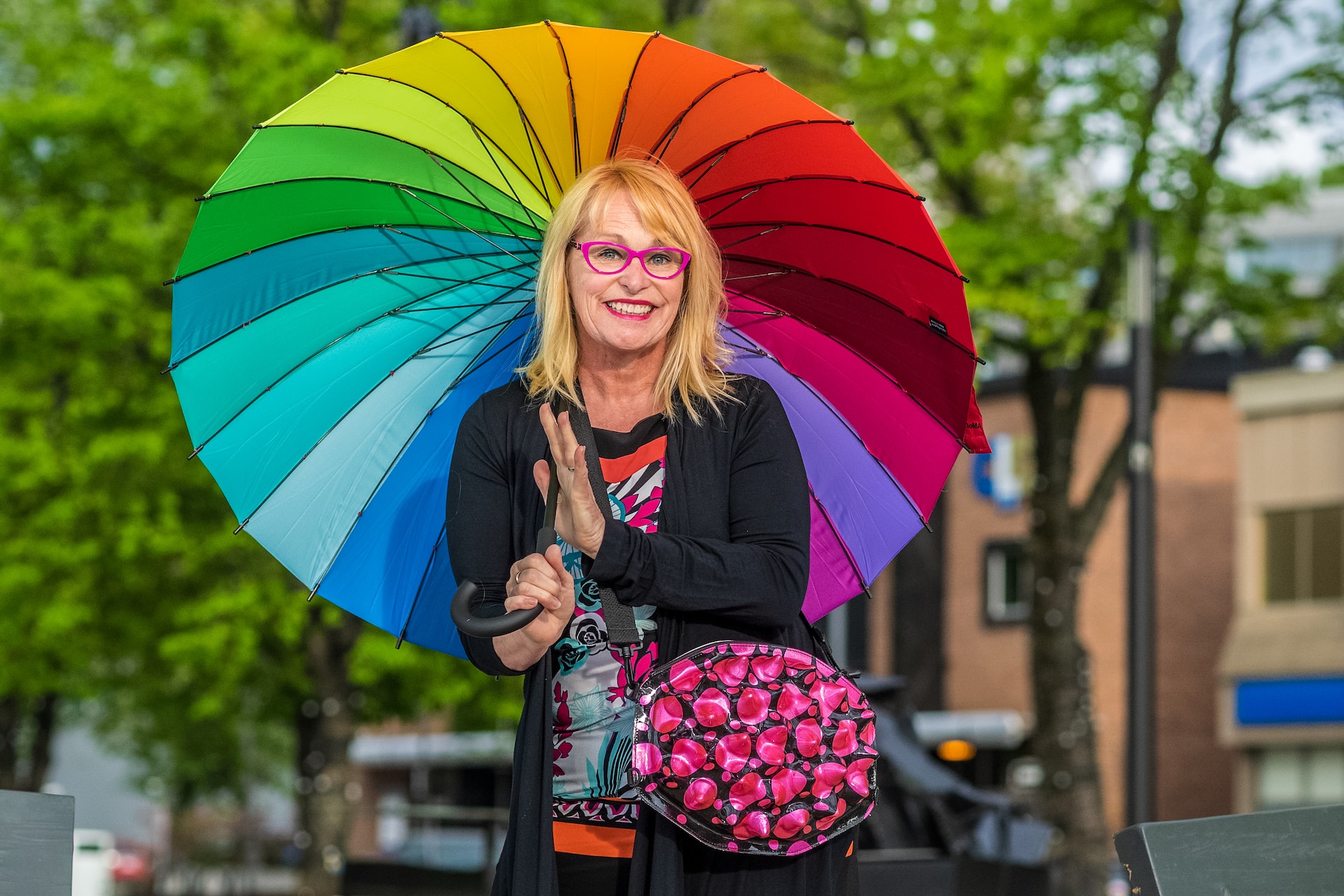 woman in black long sleeve shirt holding umbrella